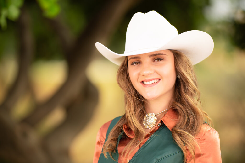 Portrait of a young woman in a cowboy hat
